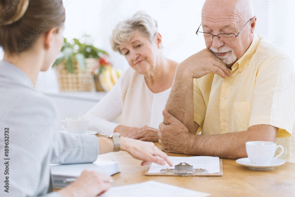 Senior people signing life insurance